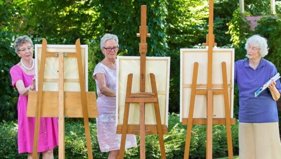 A group of woman painting at The Hamptons at Meadows Place