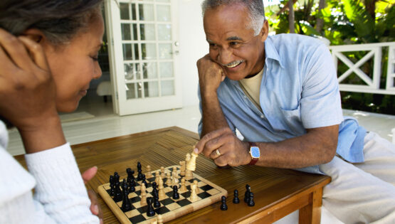 husband and wife playing chess