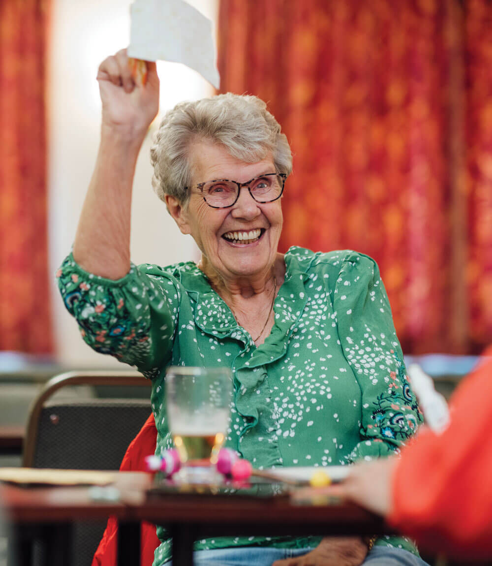 senior adult celebrating memory care | The Hampton at Meadows Place senior adult celebrating memory care