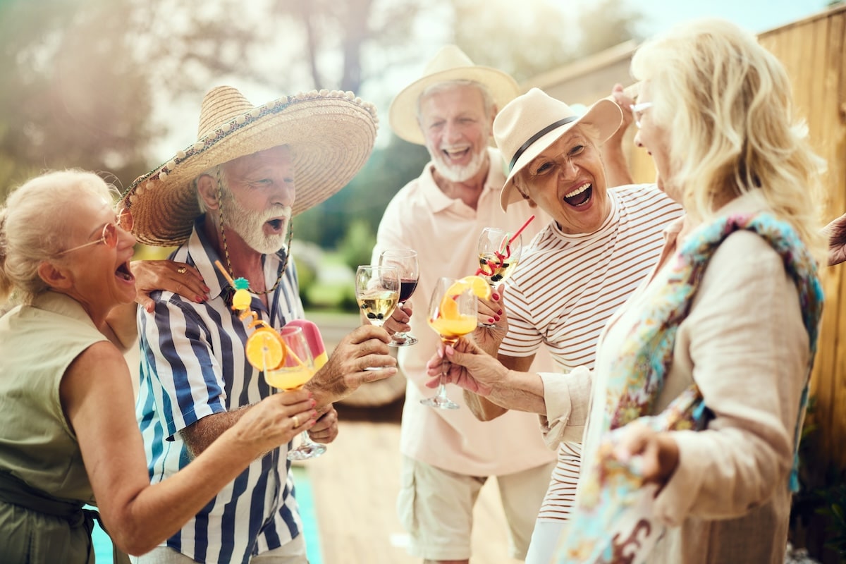 Seniors enjoy cocktails by the pool