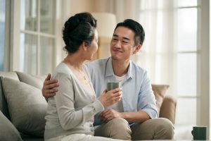 Adult son talking to his mother