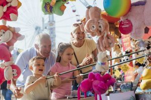 Seniors and grandkids enjoy carnival games