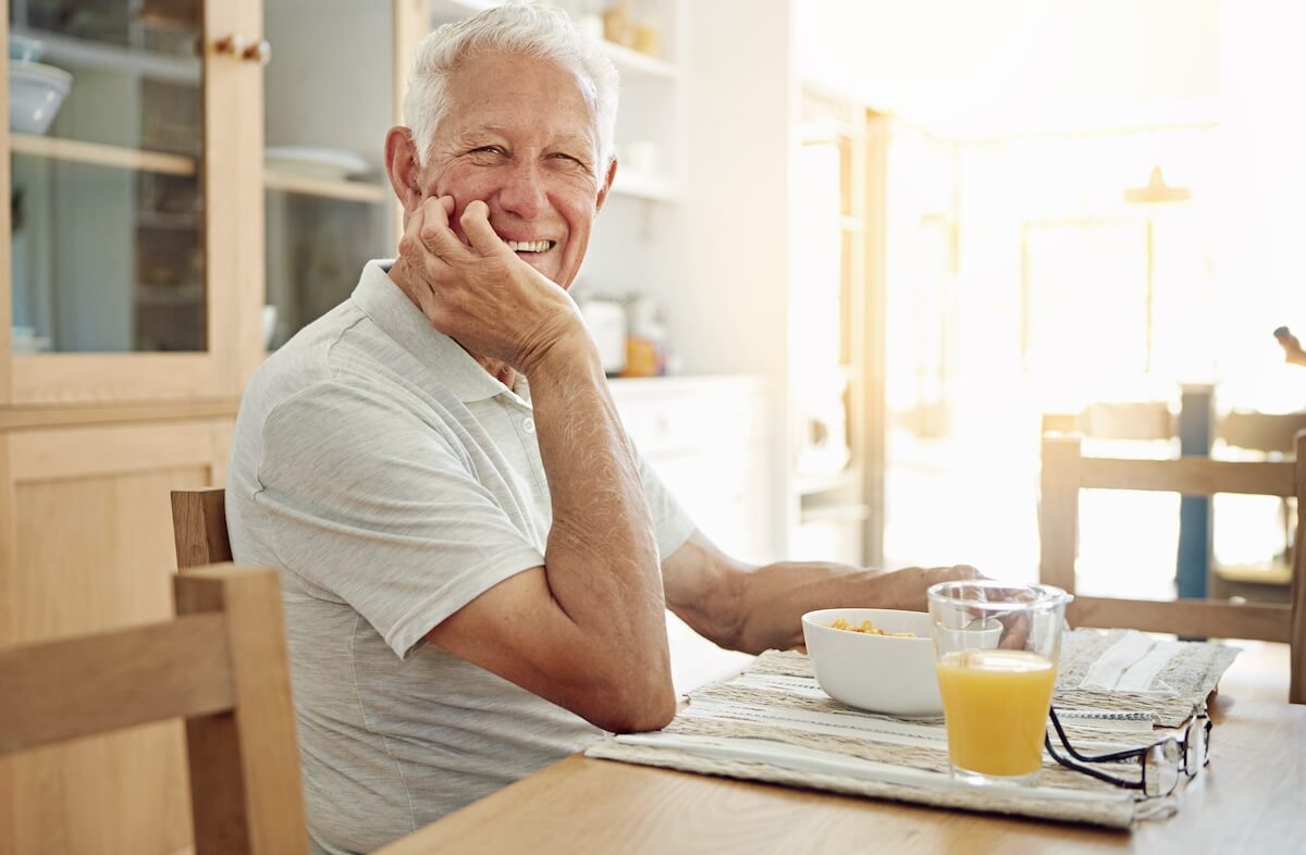 Older man having breakfast