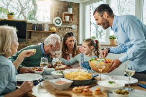 Seniors eating with their family